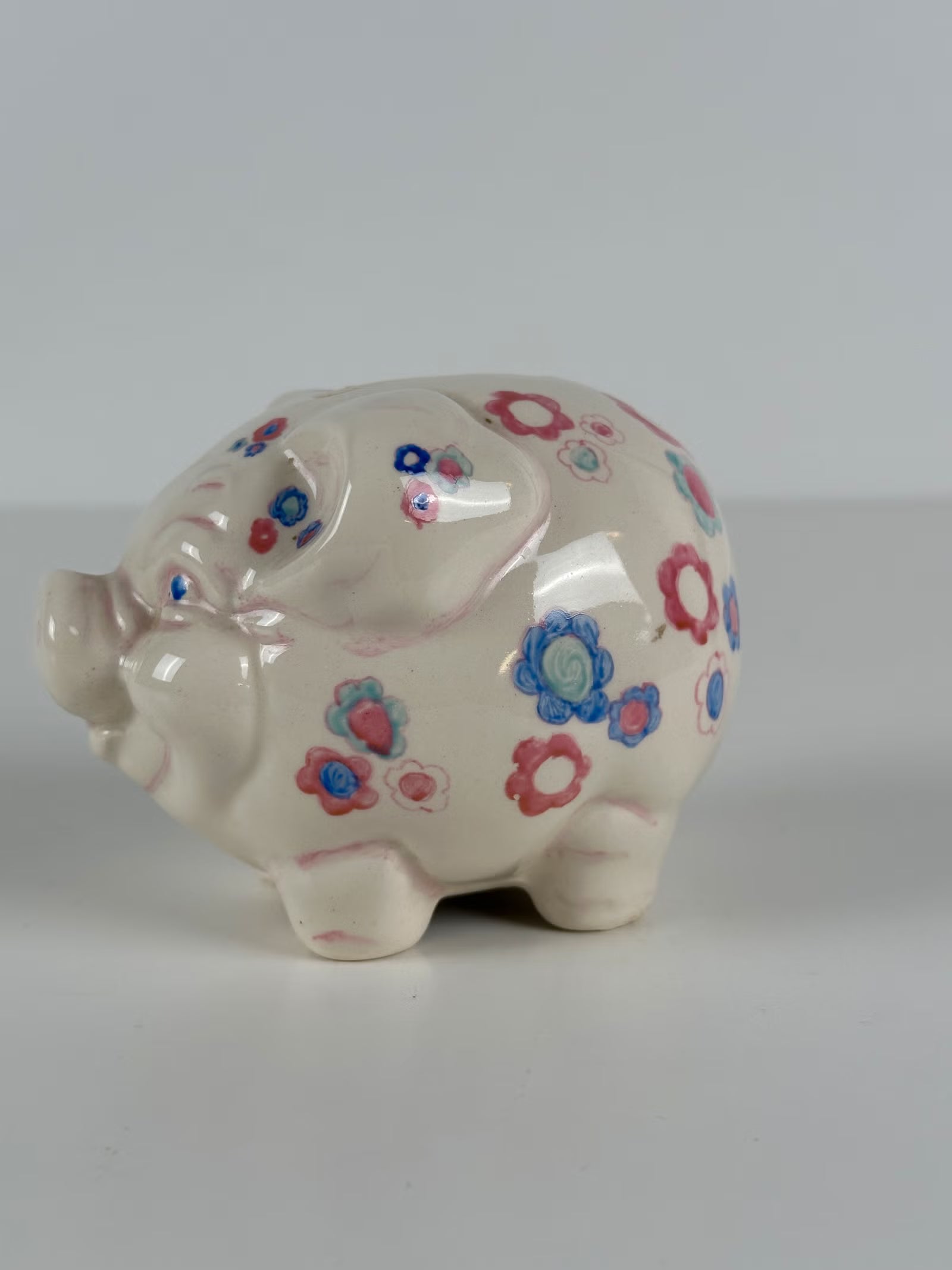 Kukkakuvioinen posliininen säästöpossu