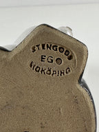 Tilgmans EGO – Stengods-kissafiguuri, 19 cm