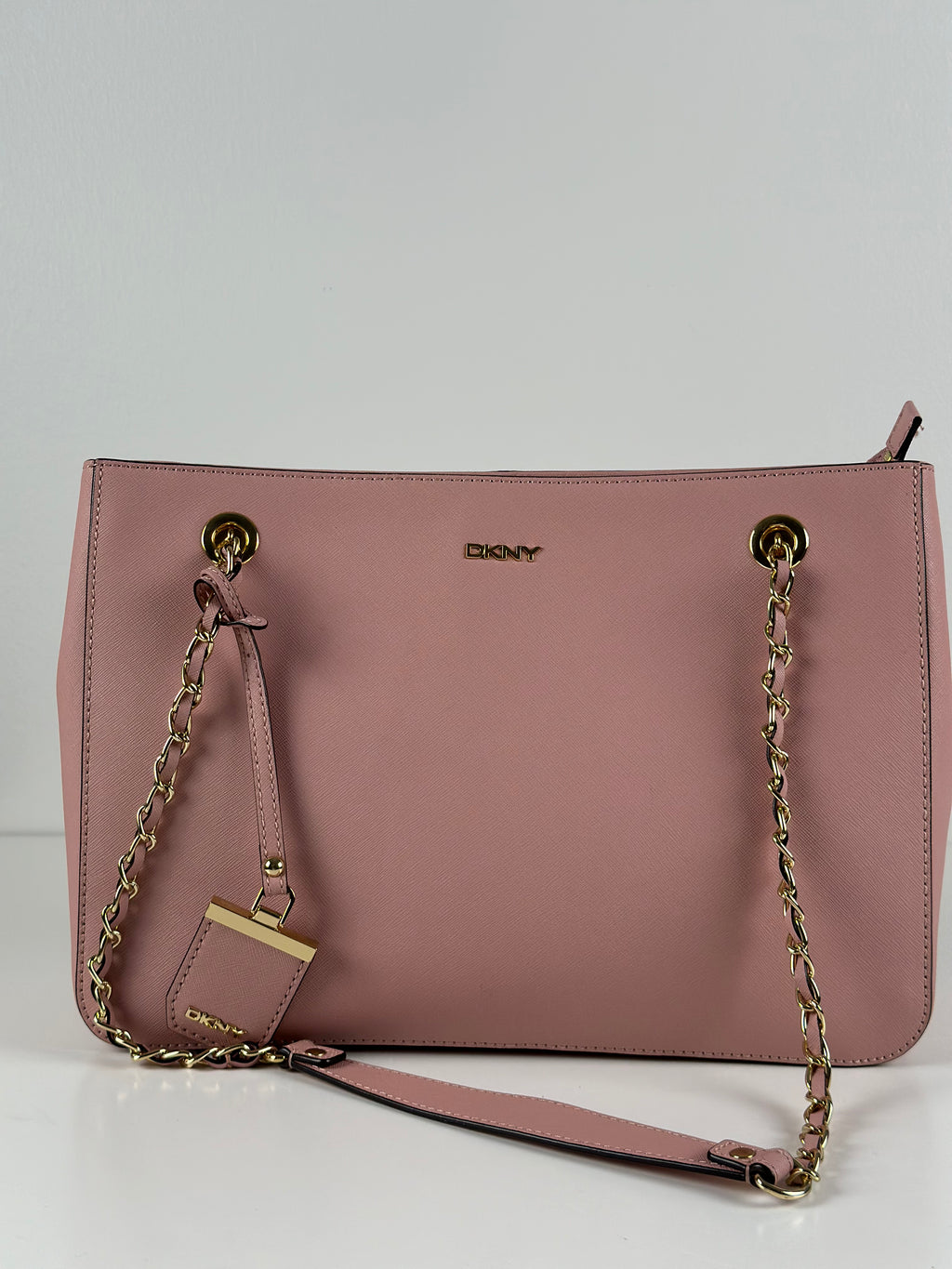 DKNY vaaleanpunainen nahkalaukku