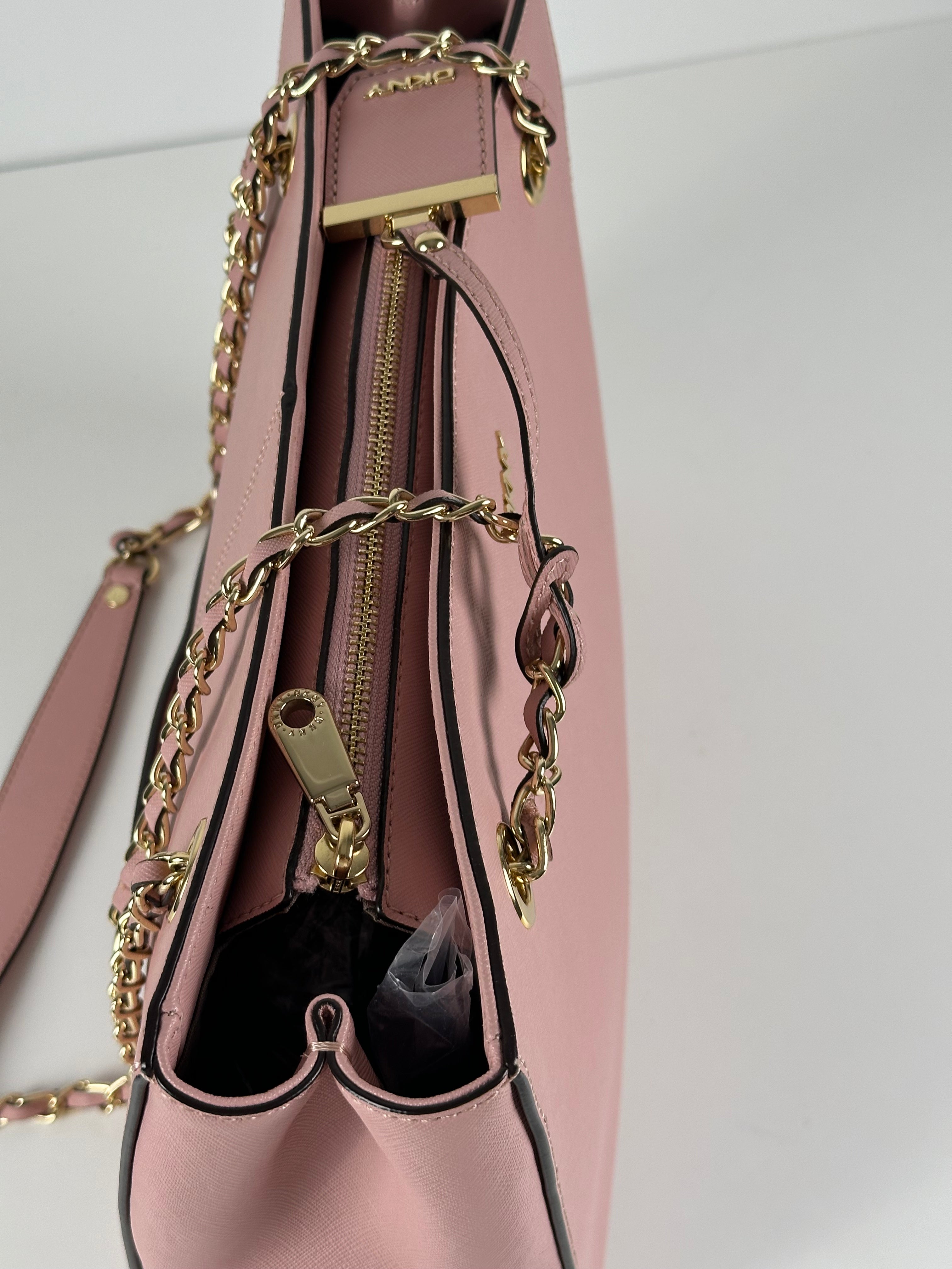 DKNY vaaleanpunainen nahkalaukku