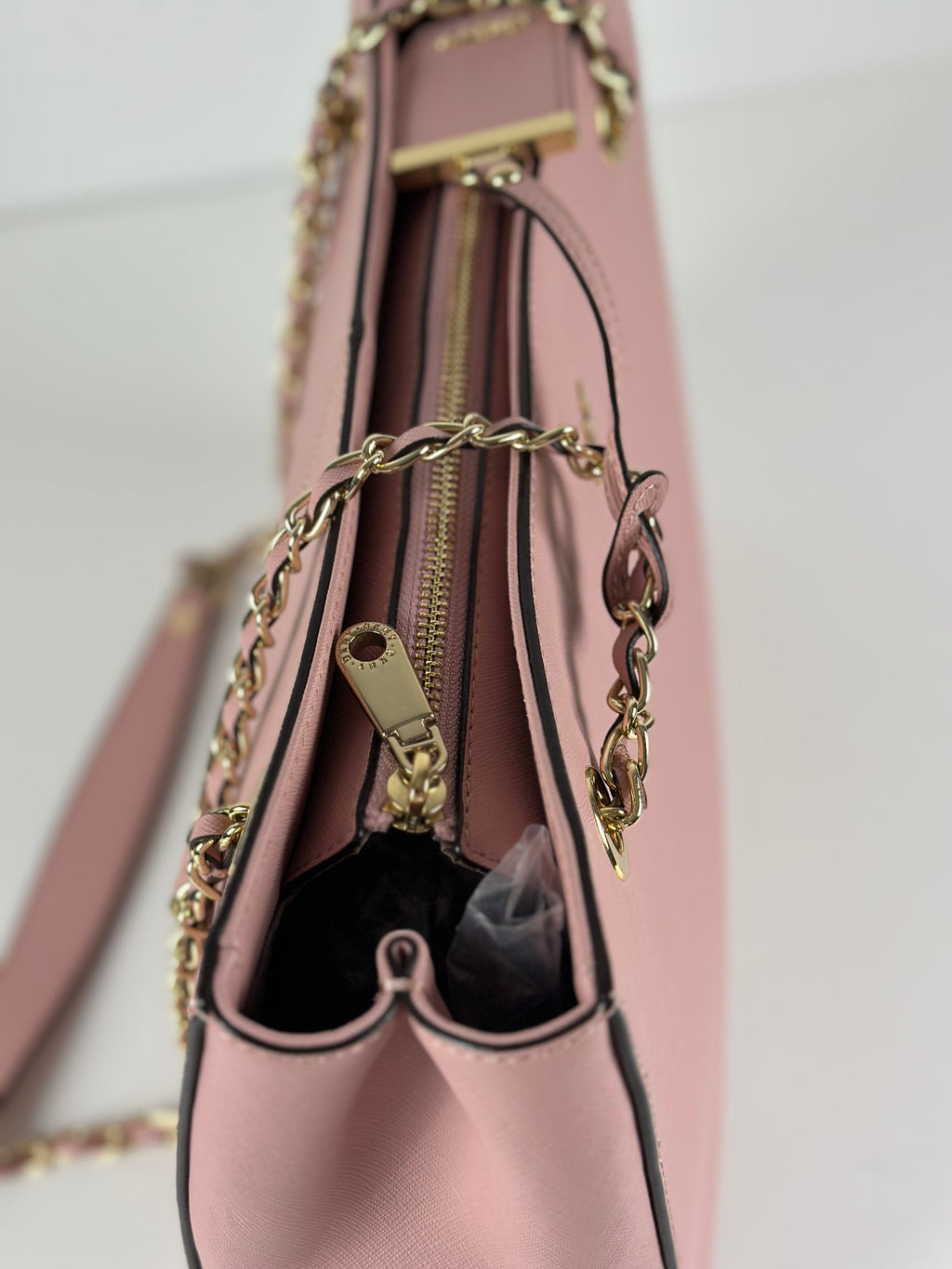 DKNY vaaleanpunainen nahkalaukku