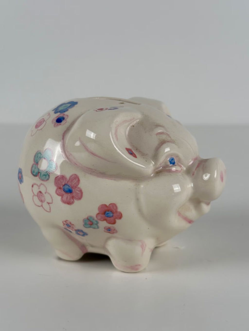 Kukkakuvioinen posliininen säästöpossu