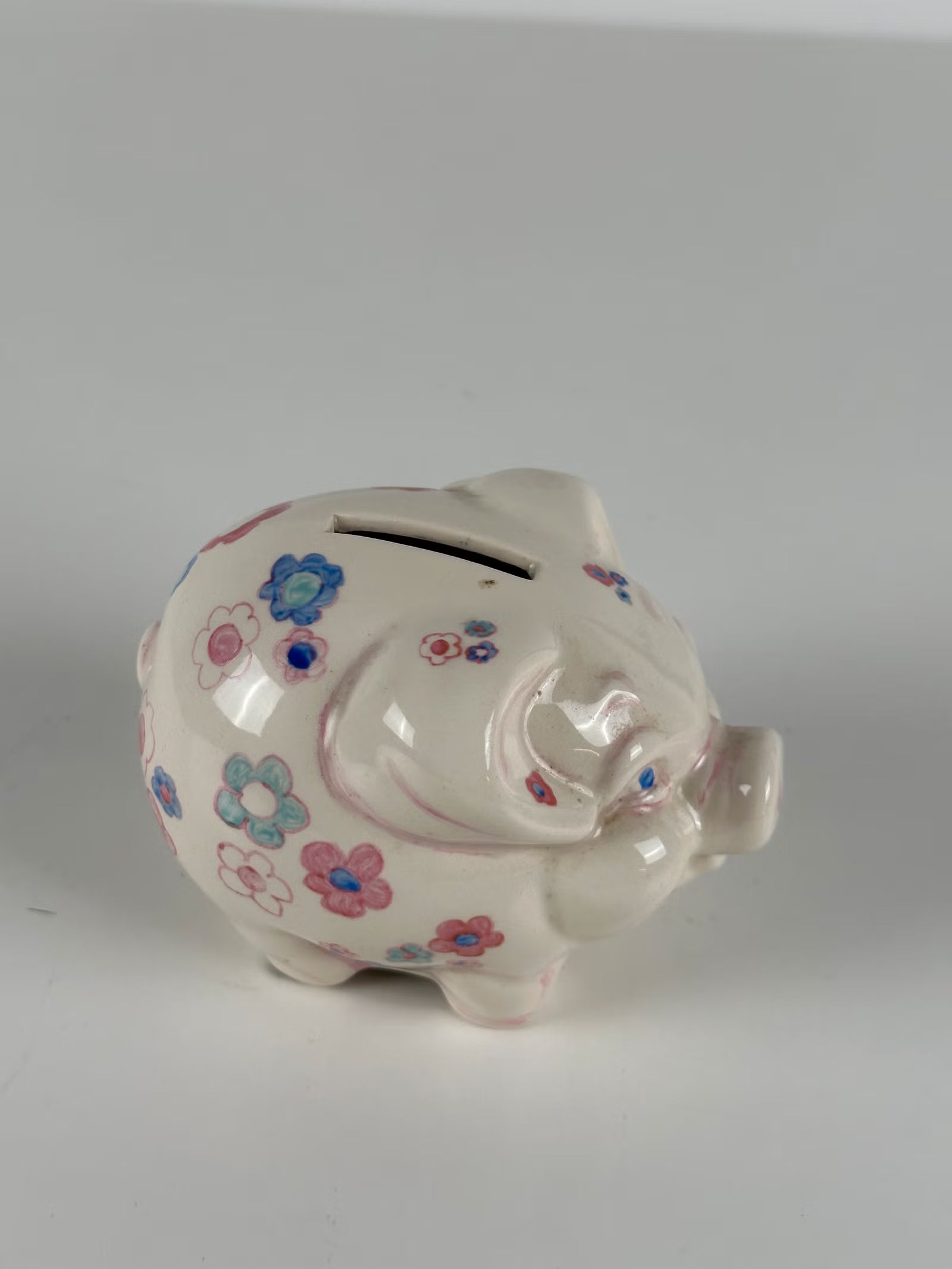 Kukkakuvioinen posliininen säästöpossu